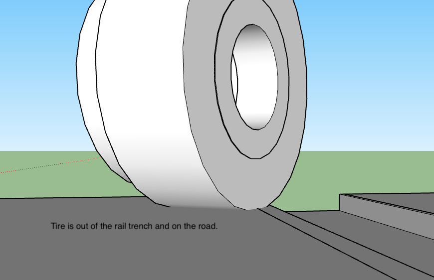 A drawing of a train track with a large object on it.